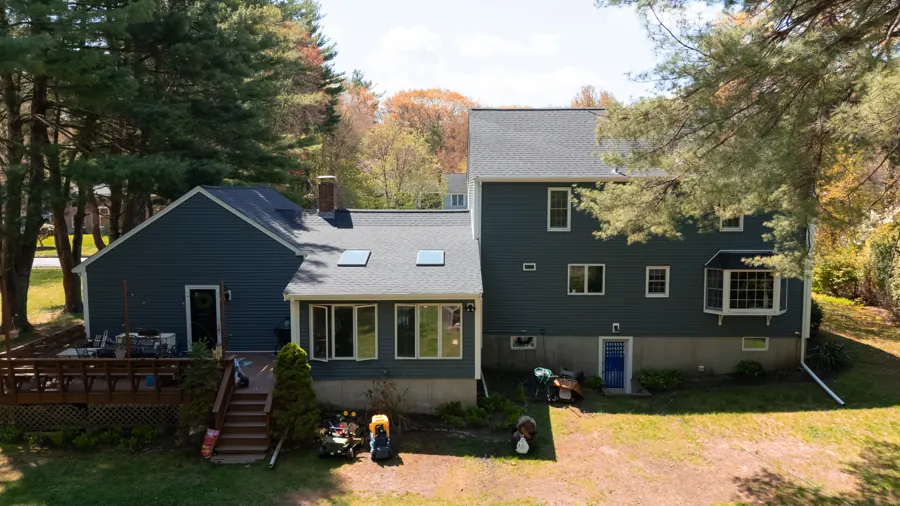 Finished exterior of a New England home with new roof