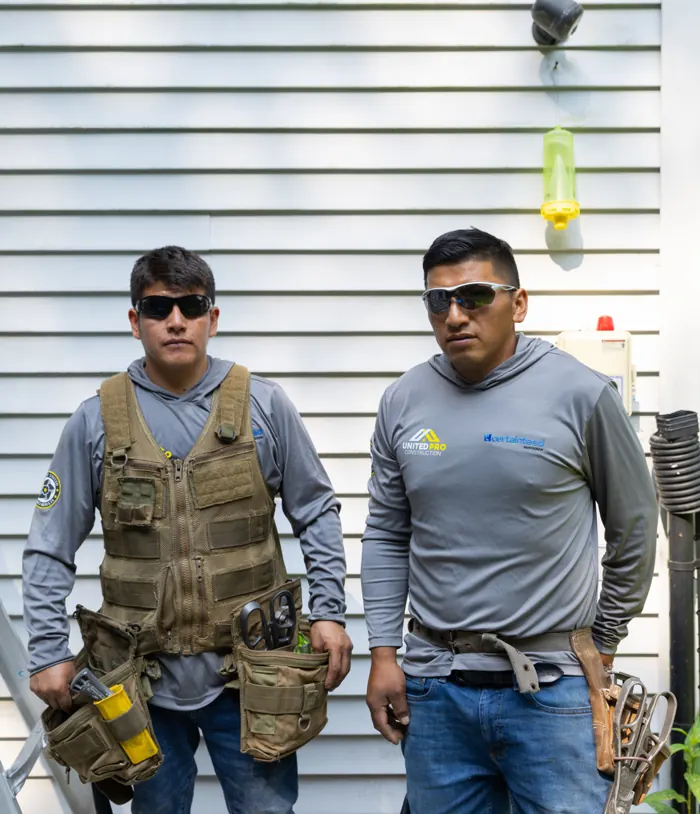 Two United Pro installers on a job site