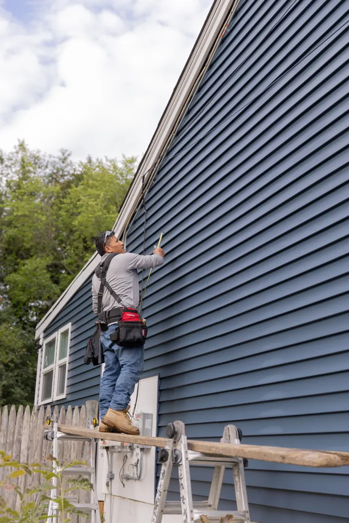 New blue lap siding going up