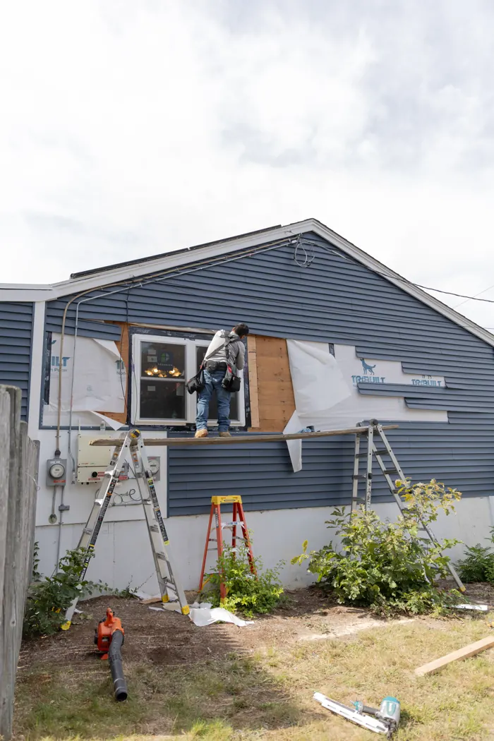 Siding repair on a blue home